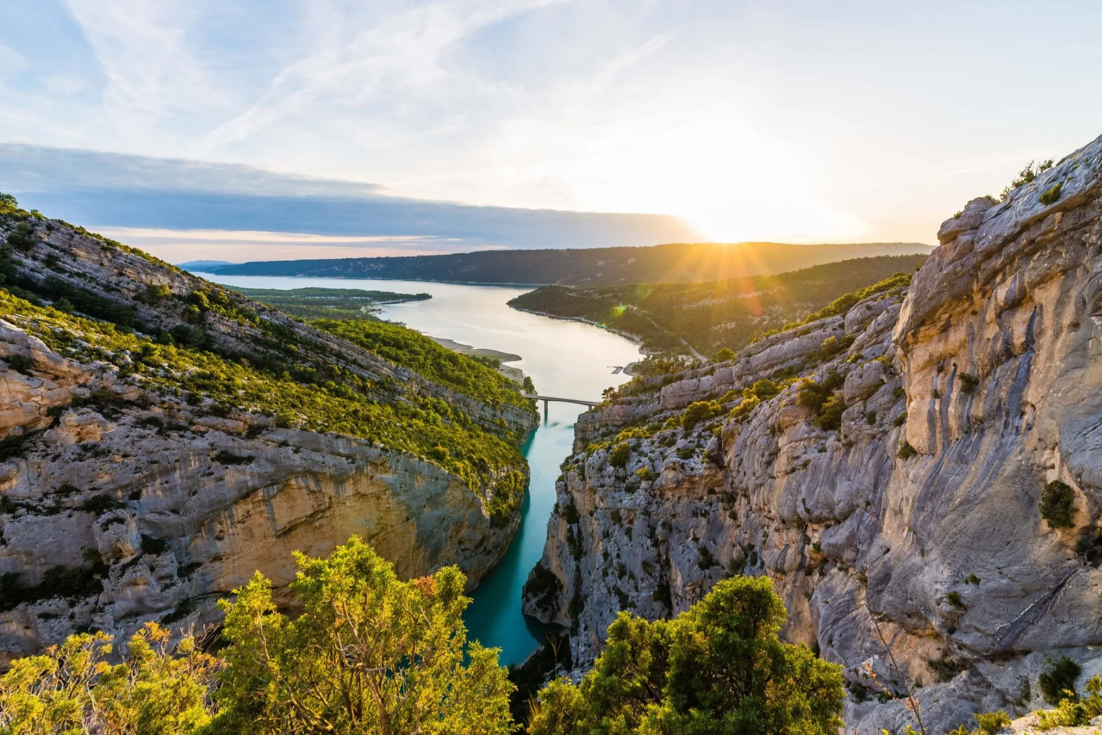 Scenic road above the turquoise Verdon canyon with dramatic limestone cliffs