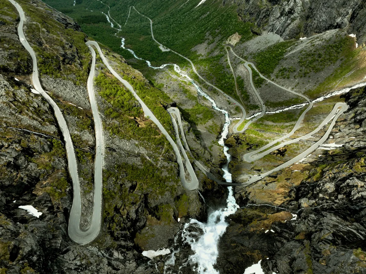 Aerial view of Trollstigen in Norway with switchbacks and waterfalls