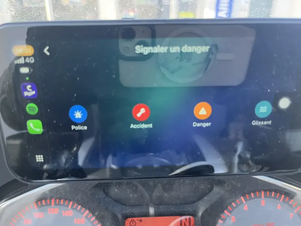 Reporting a hazard on a CarPlay screen mounted on a motorcycle
